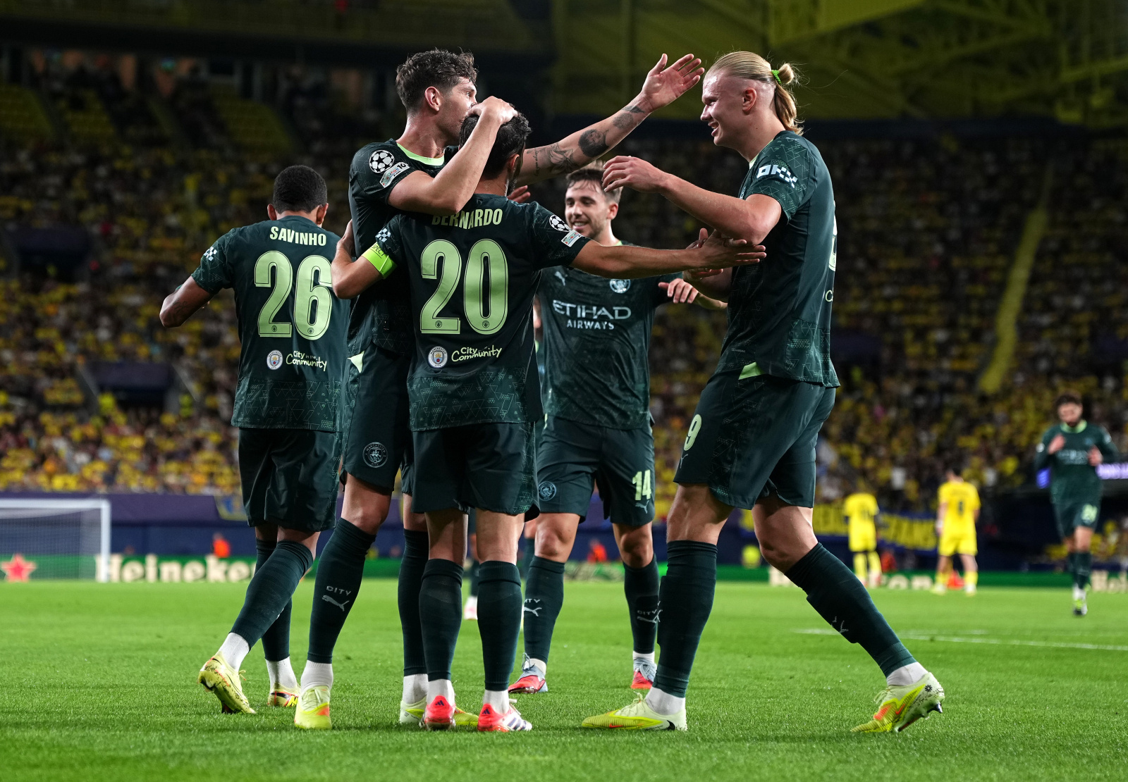 Manchester City stars celebrate after goal wearing ID UNLIMITED manufactured club font