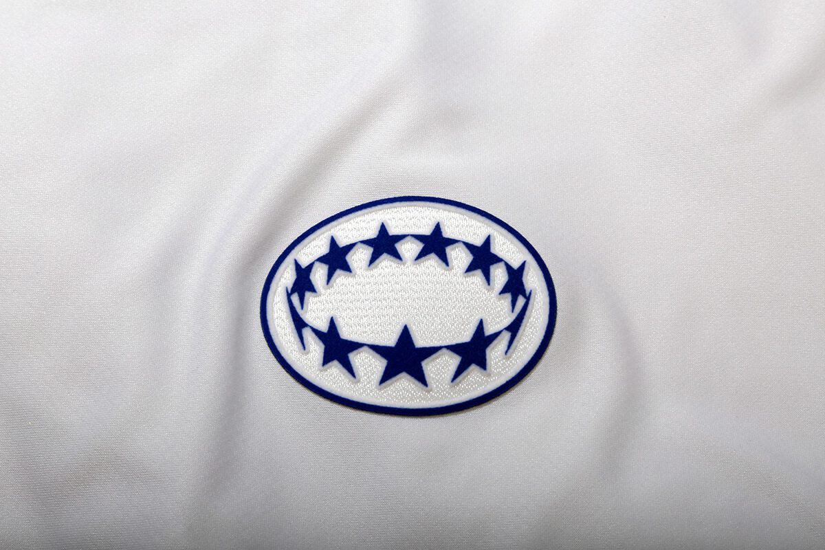Image showing the detail in a Women's UCL badge