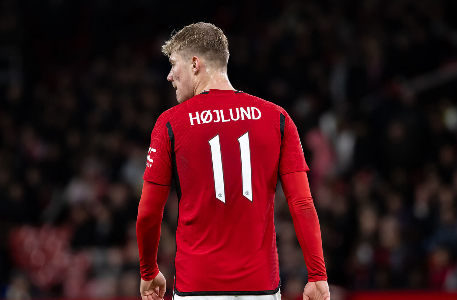 Image showing a Man Utd player posing with the official club font on his back